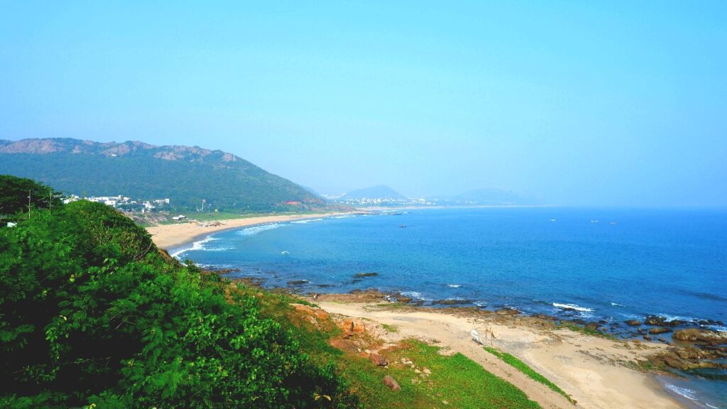Scenic coastal view of Vizag beach and surrounding hills in one of the best locations to invest in Visakhapatnam