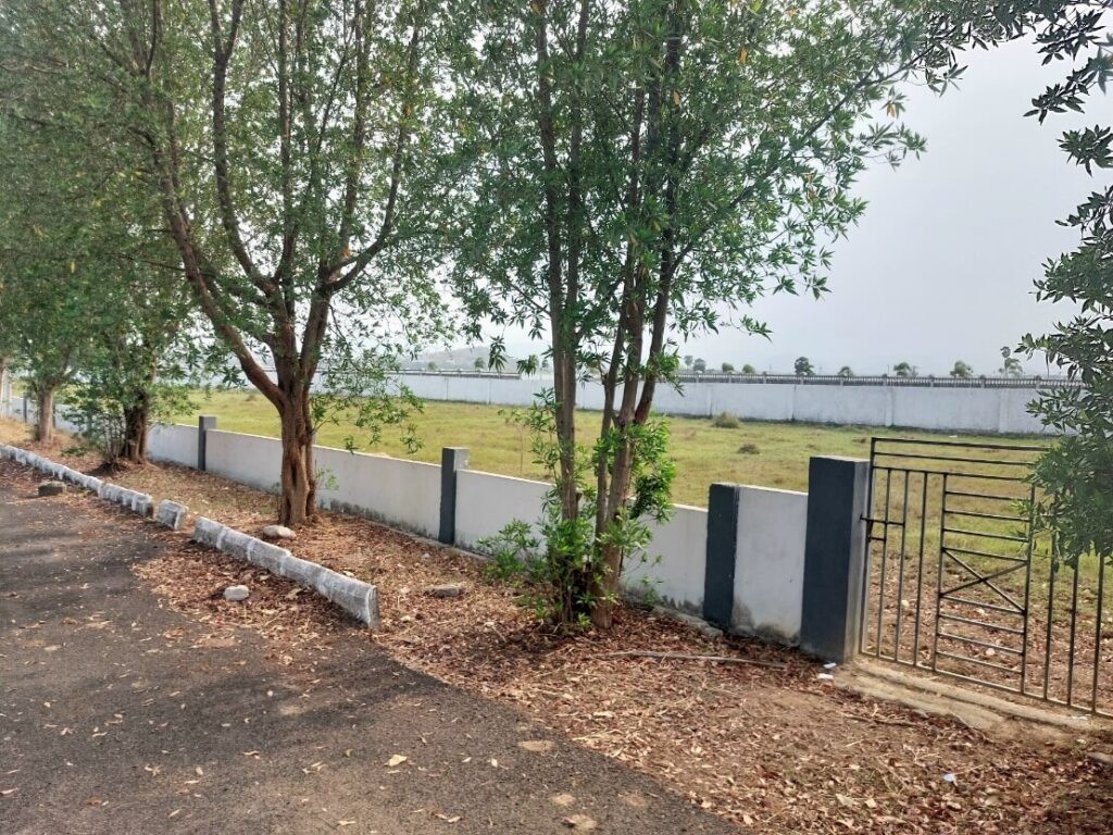 Gated VMRDA approved plots in Vizag with boundary walls, internal roads and green surroundings for secure real estate investment