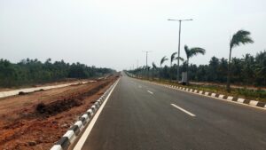 Modern road infrastructure near Bhogapuram driving Vizag real estate investment growth in 2026