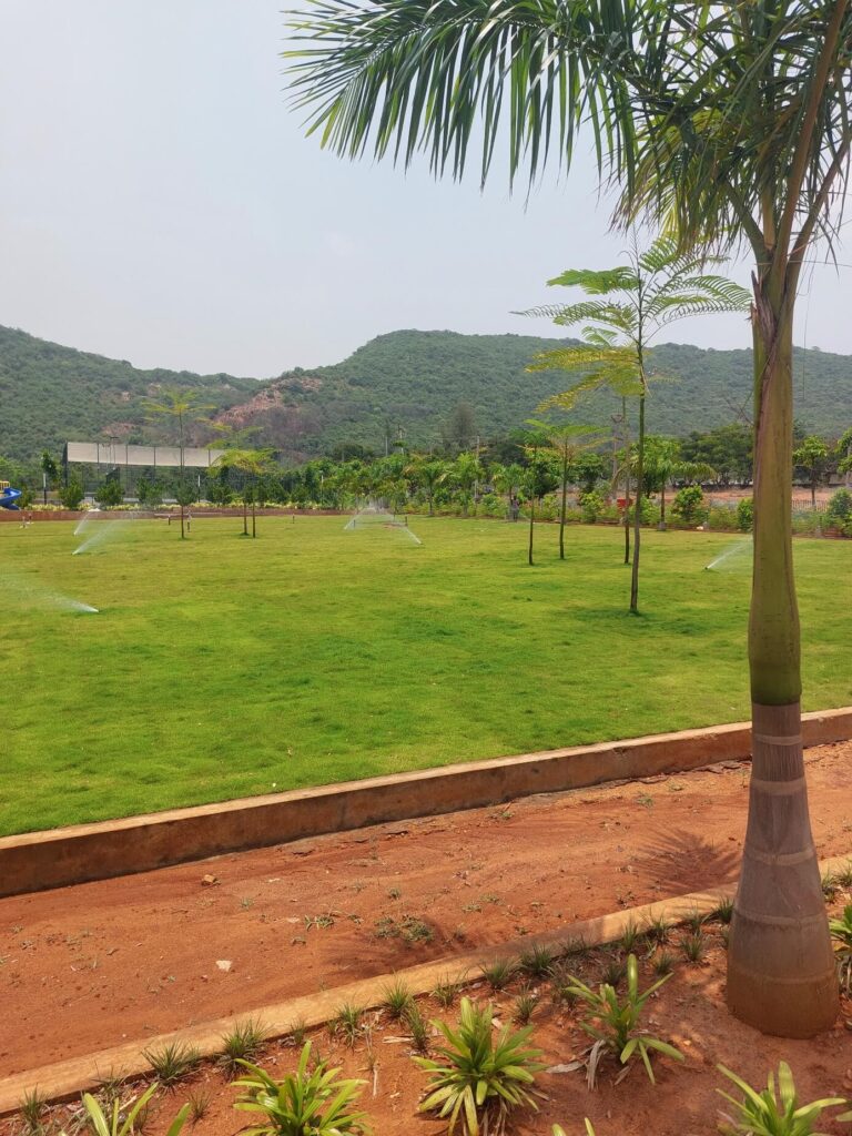 Landscaped green park and gated community amenities at Kohinoor Hills VMRDA plots project in Kothavalasa, Vizag