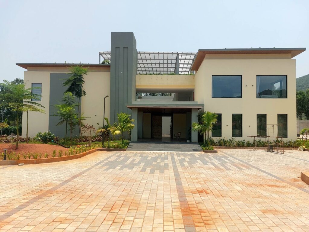 Modern clubhouse and landscaped amenities at Kohinoor Hills residential plots project in Kothavalasa, Vizag.