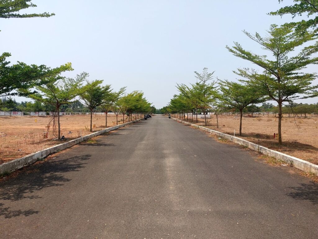 Open plots with developed internal roads at Aero City project in Bhogapuram, Vizag.