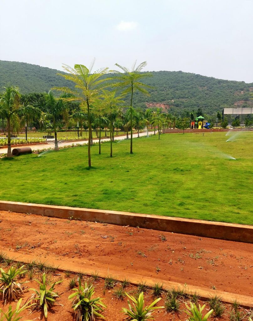 Landscaped park and open residential plots in Kothavalasa near Vizag with hill view
