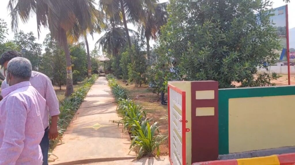 Residential plots near Rambilli and Atchutapuram Naval Base with greenery and landscaped pathway