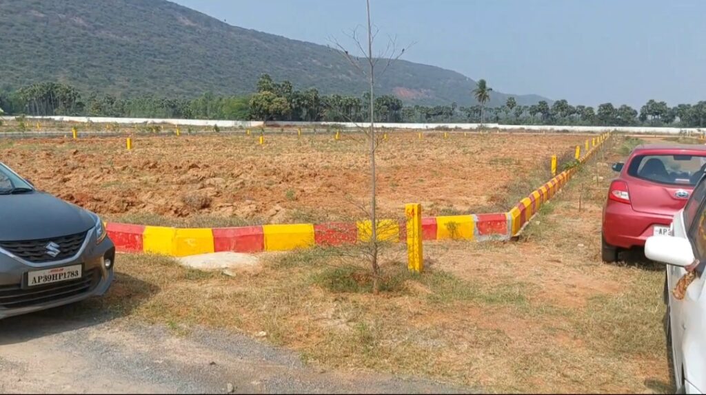 Plots near Rambilli Naval Base in Atchutapuram with clear layout marking and hill view