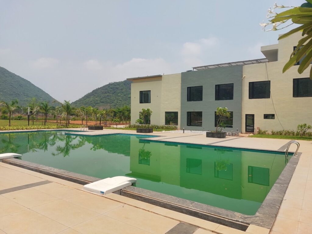 Swimming pool and premium clubhouse amenities at Kohinoor Hills residential plots project in Kothavalasa, Vizag.