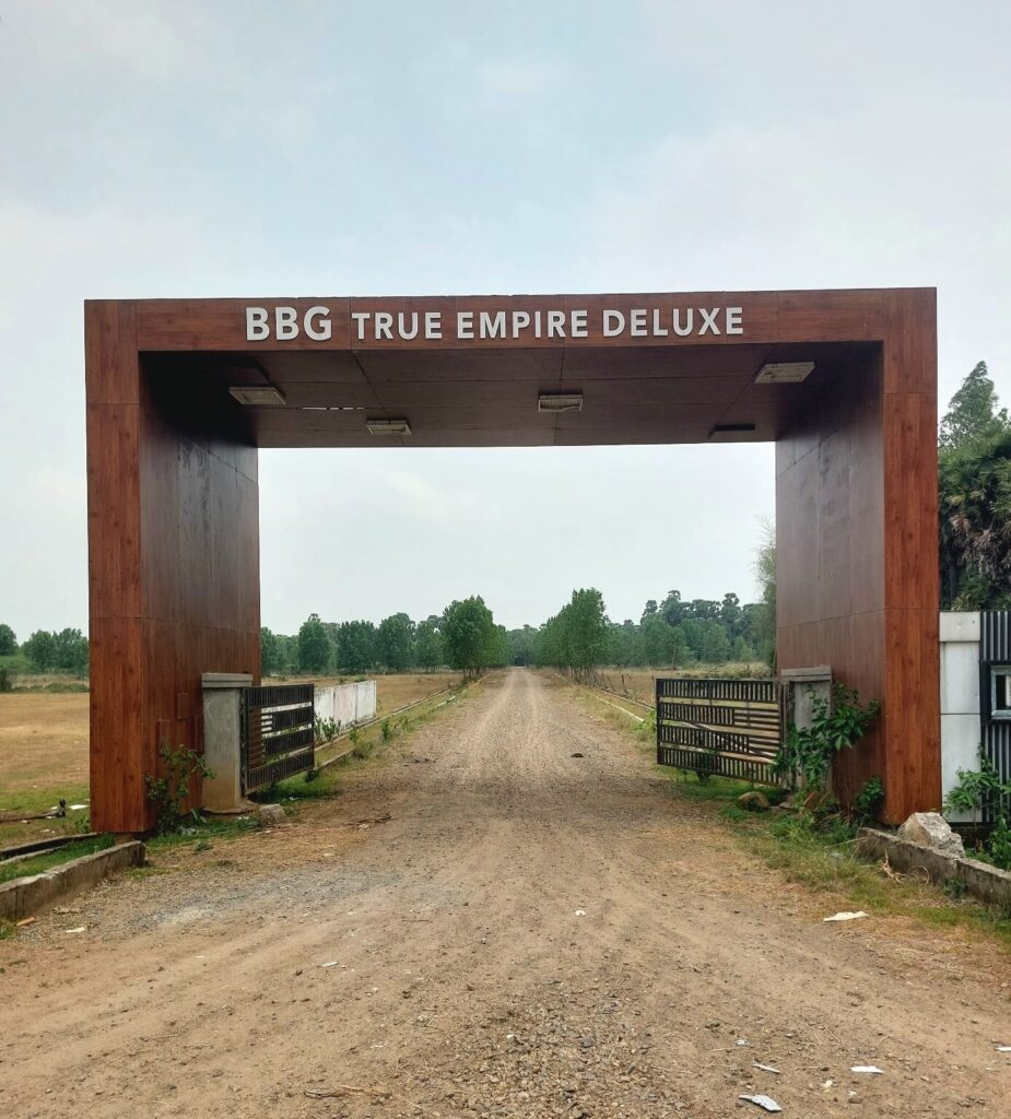 Entrance arch and internal road at True Empire Deluxe residential plots project in Raghumanda, Vizianagaram.