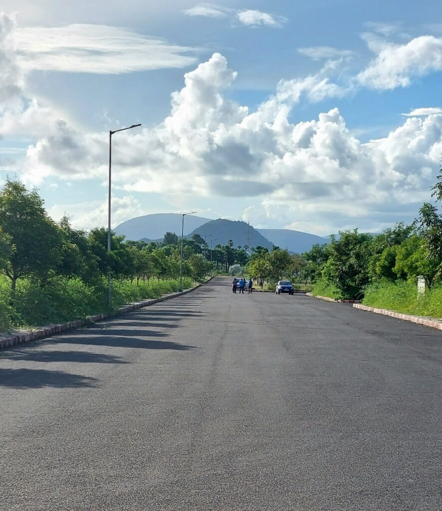 Dream Valley Bheemili internal black-top road development in VMRDA-approved plotted layout