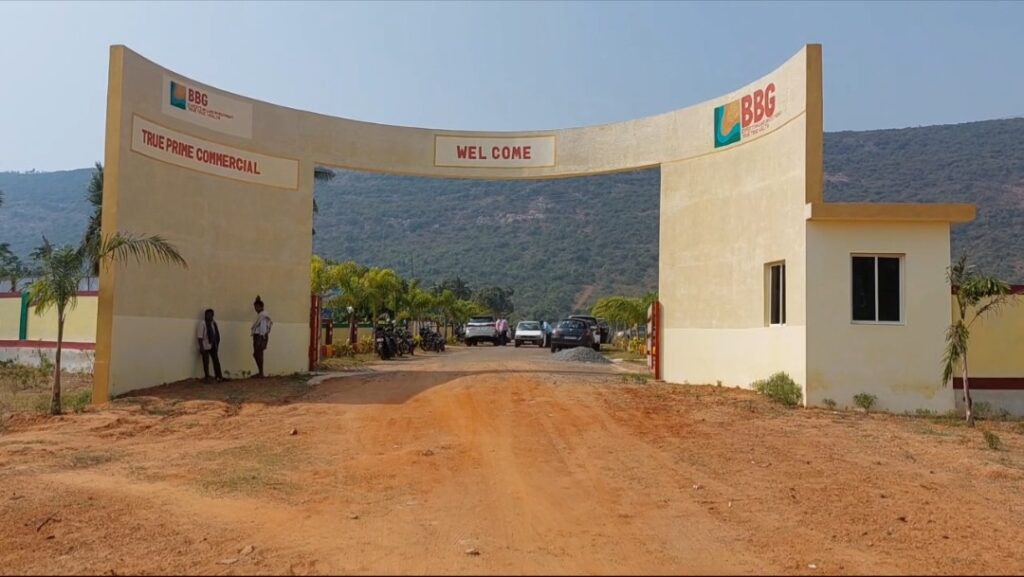Residential plots near Anakapalli with gated entrance, internal roads, and scenic hill surroundings