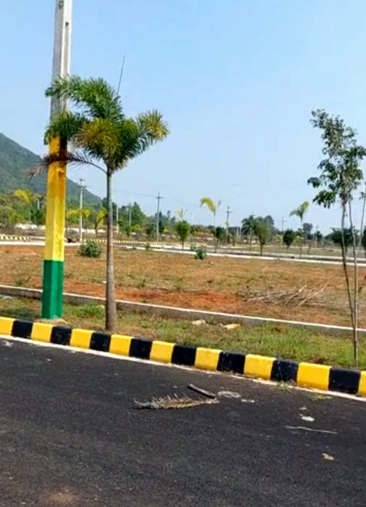 Plots near Tarluvada with developed road and landscaped surroundings