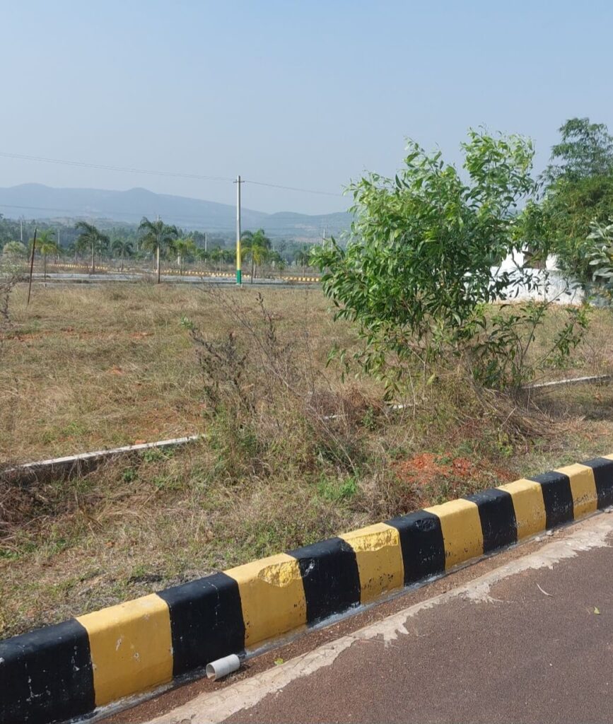 Boundary road and landscaped surroundings at True Residency Near Tarluvada, VMRDA Approved Open Plots in Anandapuram